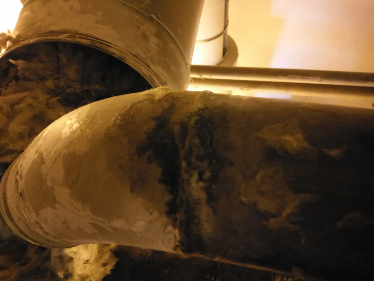 Insulation opened around an industrial process-line weld
