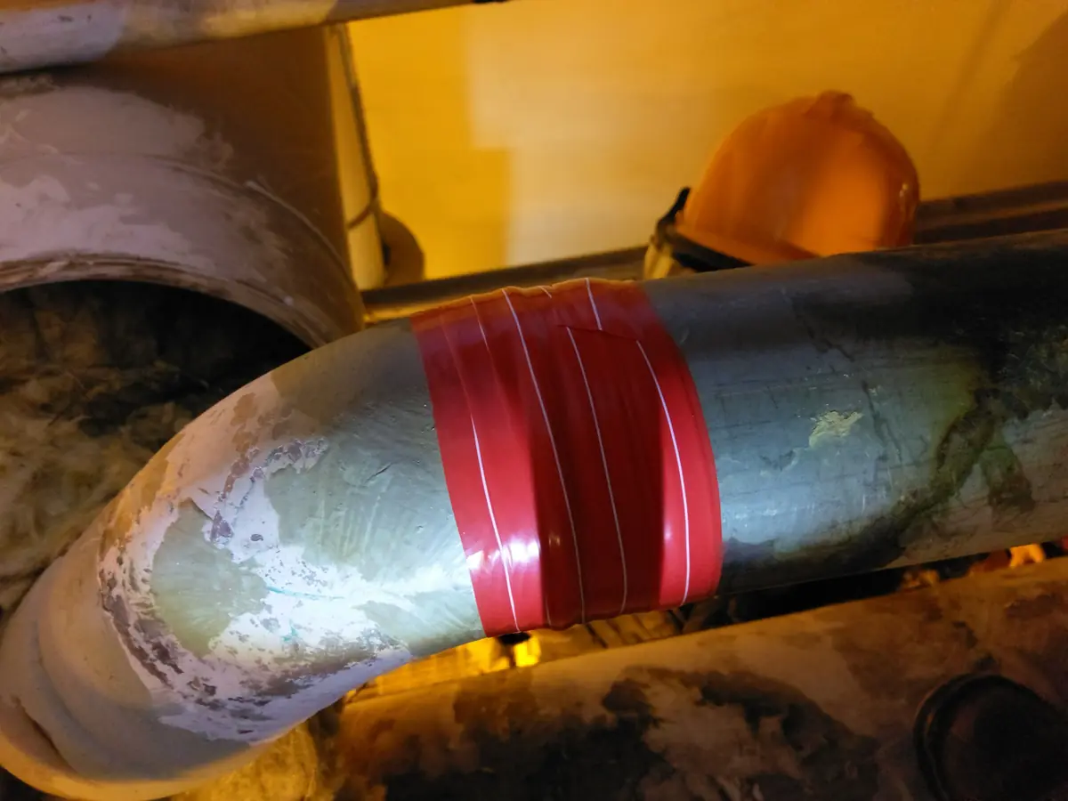Red site-formed ISB under construction around the process-line weld