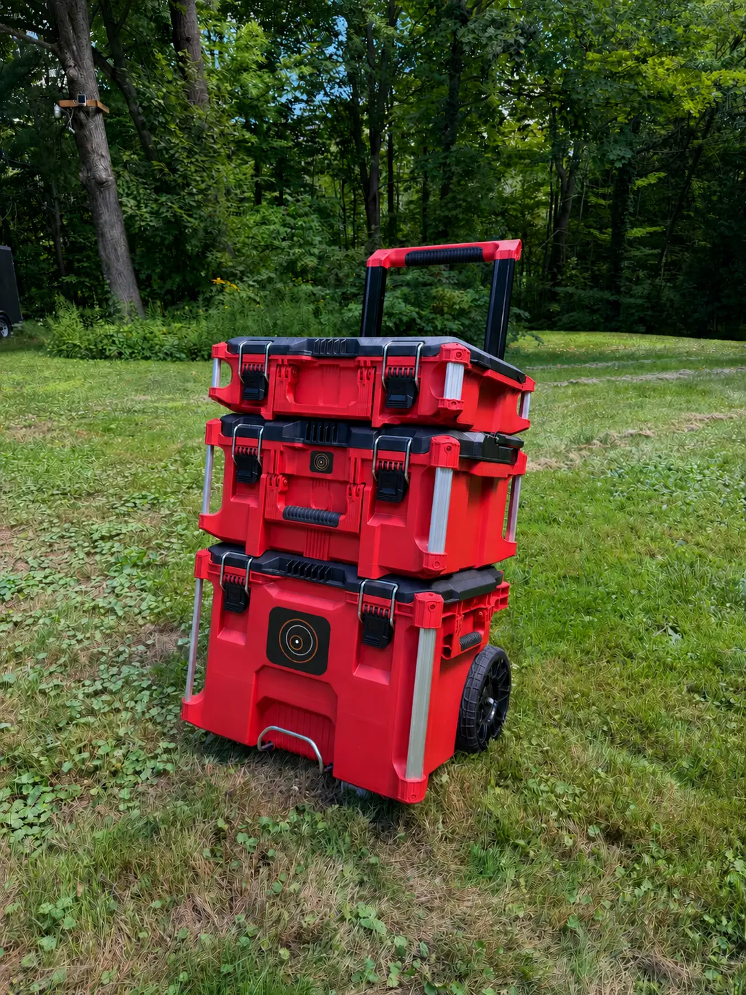 Red modular rolling cases carrying a DendroSeal Method Kit configuration, photographed outdoors.