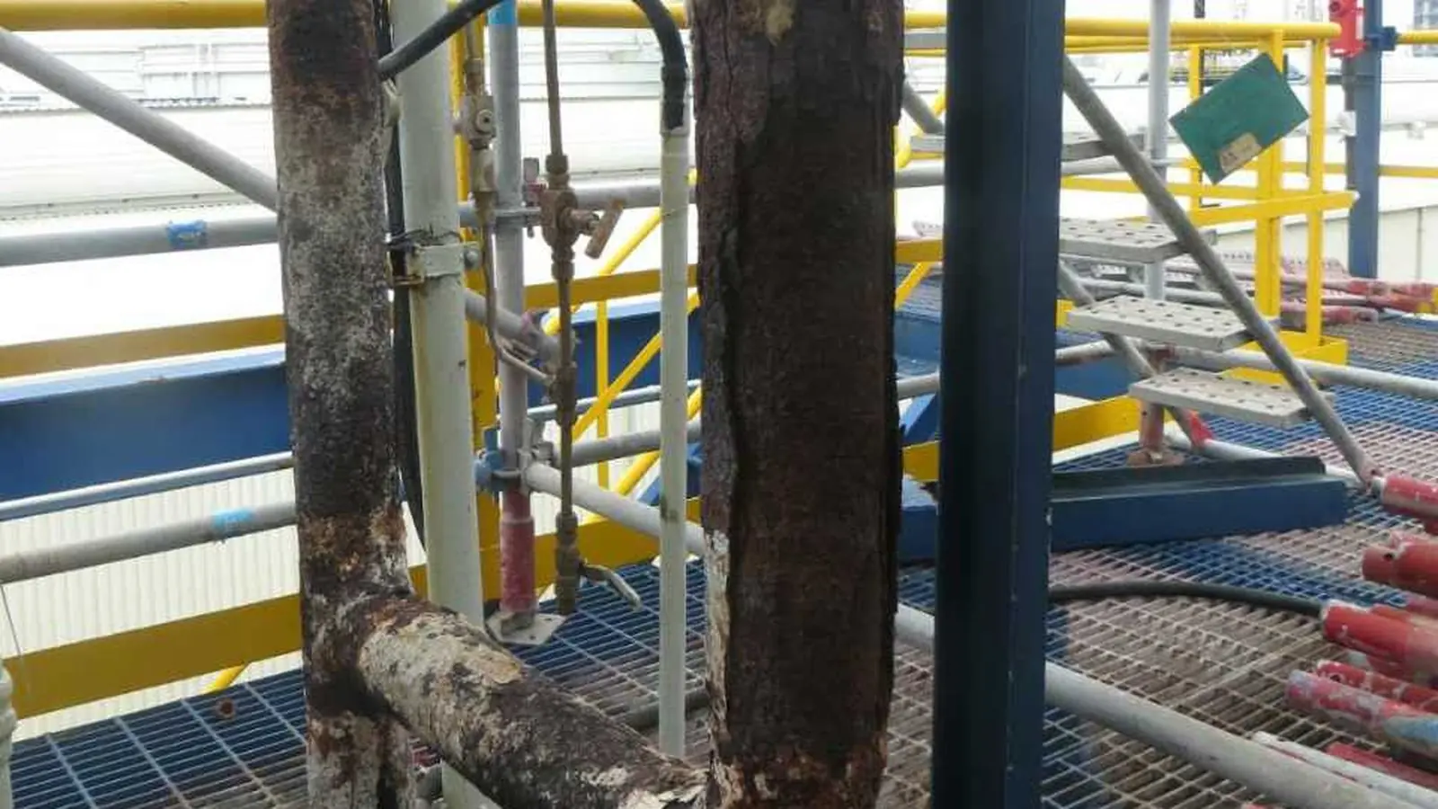 Severely corroded industrial pipe before ISB construction