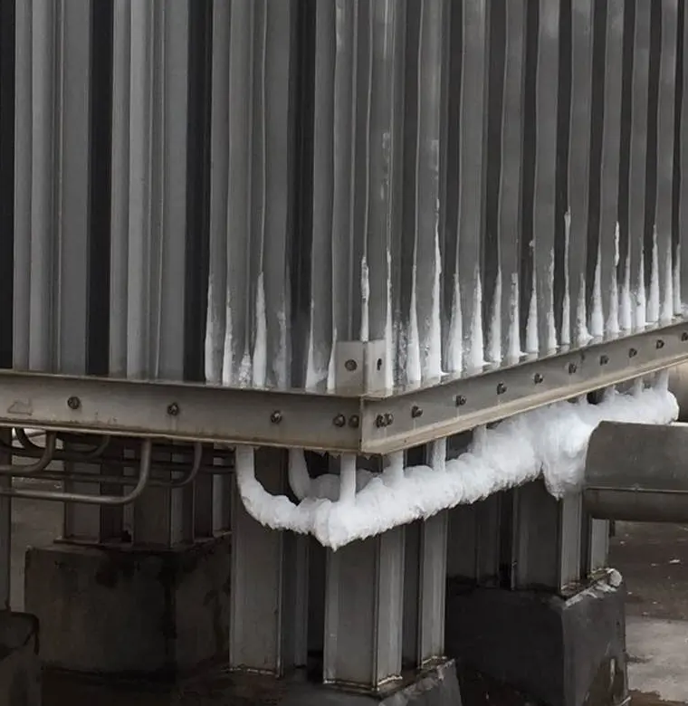 Cropped LNG-service pipework with localized frosting and identifying surroundings removed